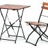 Table et chaise d\'extérieur en acier noir et bois d\'acacia, gamme Bartolo - France Bureau