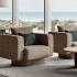 Fauteuils design taupe avec coussins anthracite dans un salon d\'attente vitré, gamme Misurina - France Bureau