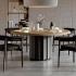 Table de réunion ronde bois clair et piètement anthracite dans un espace d’accueil, gamme Misurina - France Bureau